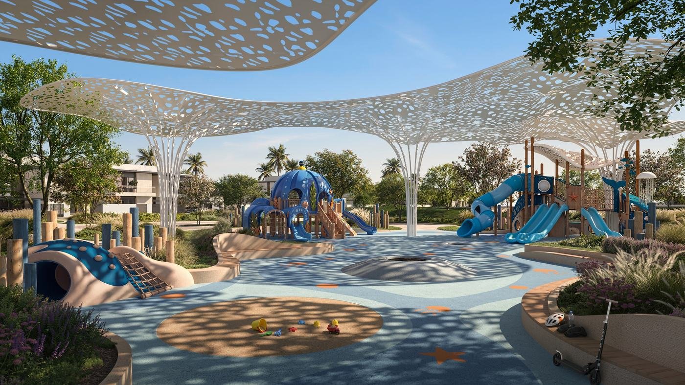 Shaded community seating, pool and play area at Talay